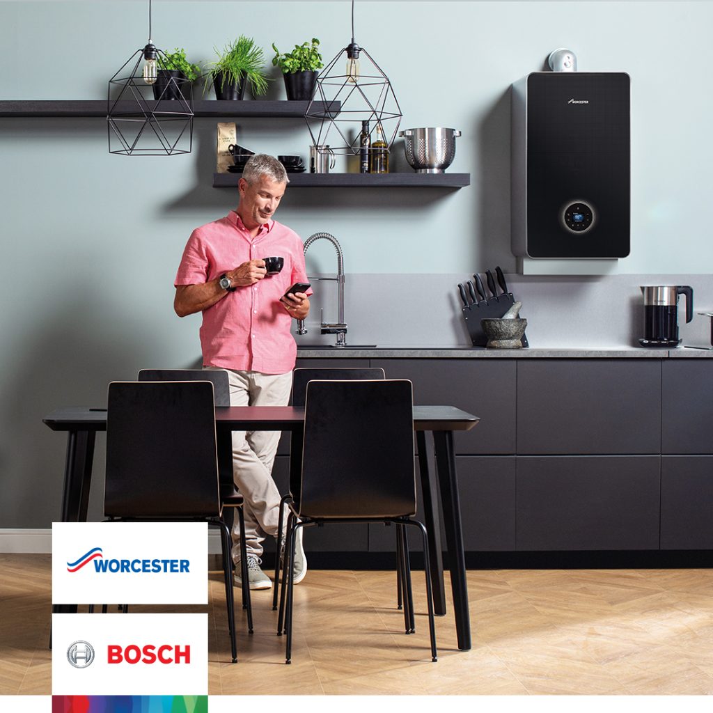 man stood infront of black boiler